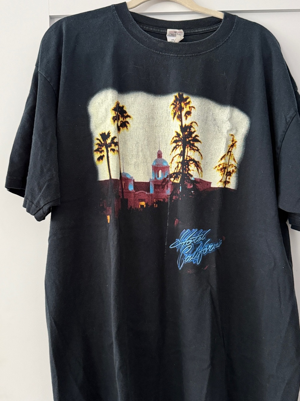Vintage Black Graphic Tee with Sunset Palm and Hotel Print